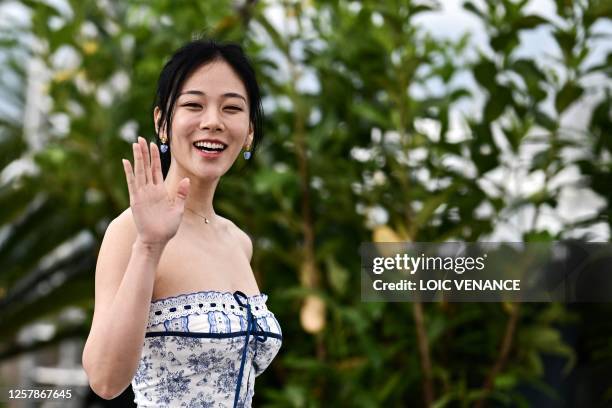 South Korean singer and actress Kim Hyung-Seo aka Bibi waves during a photocall for the film "Hwa-Ran" at the 76th edition of the Cannes Film...