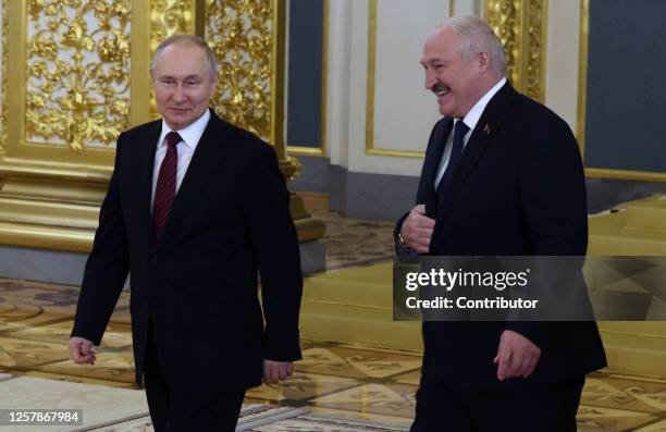 Russian President Vladimir Putin and Belarussian President Alexander Lukashenko enter the hall during the Supreme Economic Eurasian Council at the...