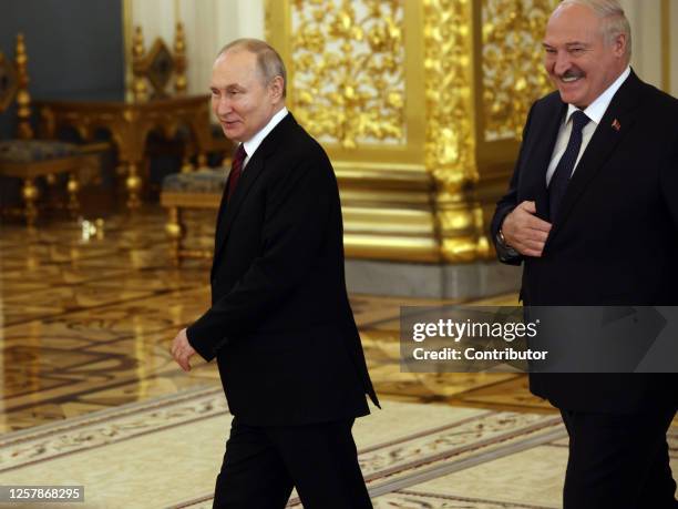 Russian President Vladimir Putin and Belarussian President Alexander Lukashenko enter the hall during the Supreme Economic Eurasian Council at the...