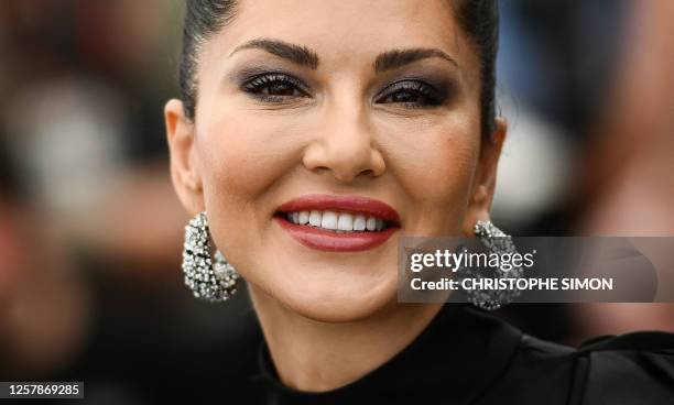 Canadian actress Sunny Leone poses during a photocall for the film "Kennedy" at the 76th edition of the Cannes Film Festival in Cannes, southern...