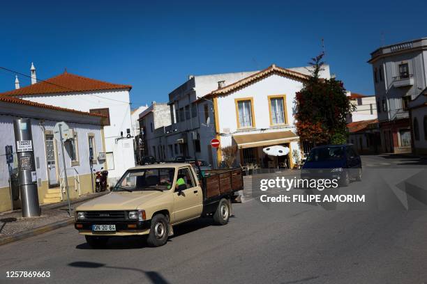 Cars drive in Algoz, a town near the Arade dam in Silves on May 25 on the third day of new search operations amid the investigation into the...
