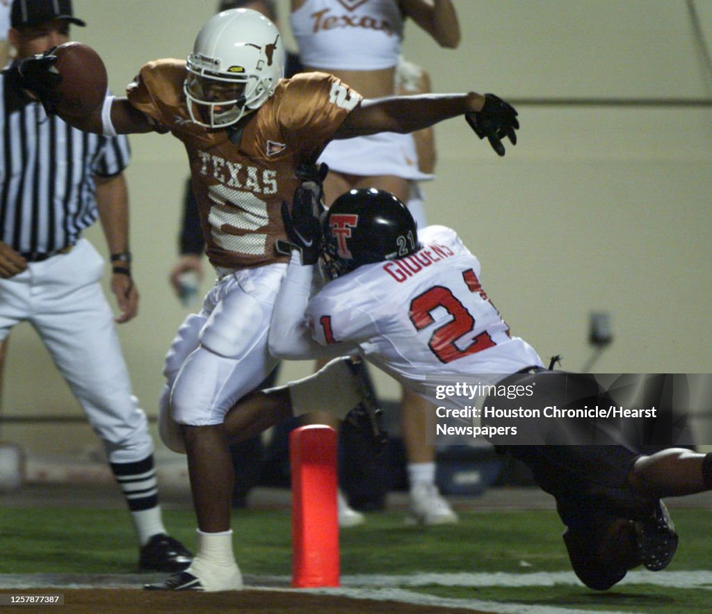Montrell Mathis Texas reciever Montrell Flowers tip-toes across the goalline as he is ...