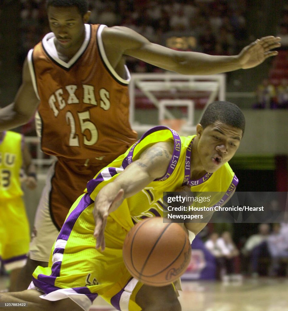 Colm Torris LSU's Torris Bright grabs a loose ball in front of Darren Kelley ...