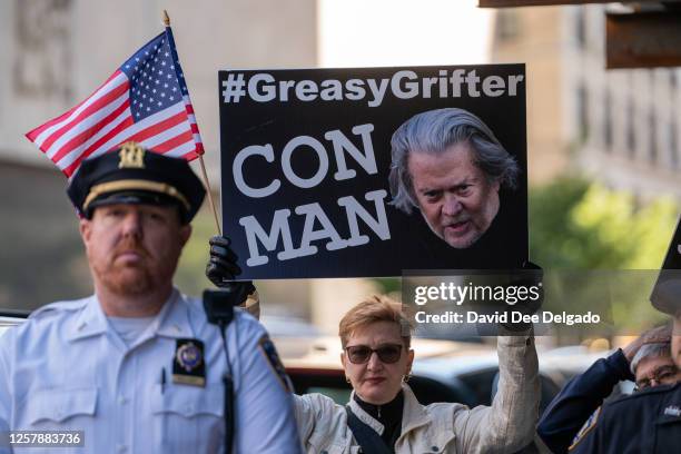 Protestor waits for Steve Bannon, former advisor to President Donald Trump, to arrive at New York State Supreme Court on May 25, 2023 in New York...