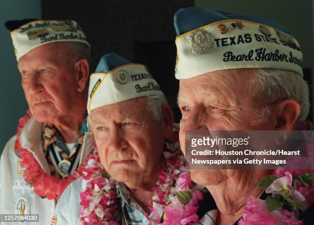 Veterans of the attack on Pearl Harbor, from right, Howard Snell, Lewis LaGesse and George Hemingway, photographed Wednesday afternoon, November 14...