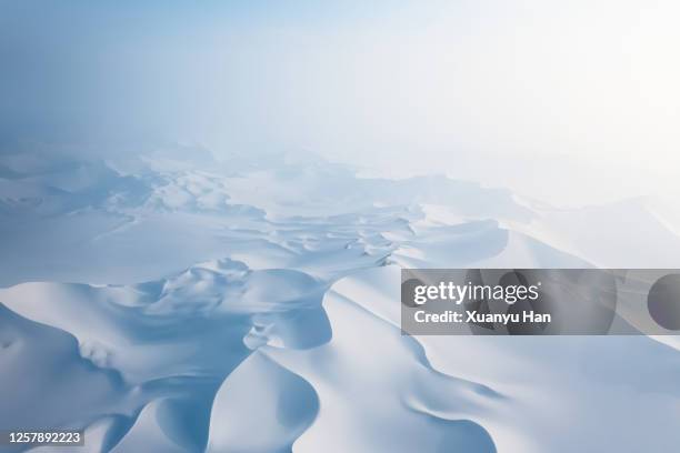 aerial view of snow covered desert sand dunes - whiteout stock pictures, royalty-free photos & images