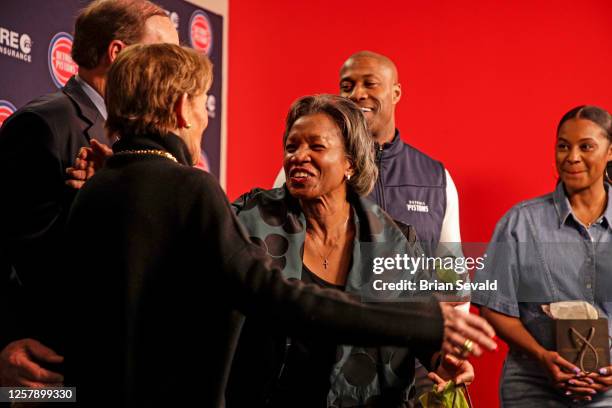 Sportscaster, George Blaha, and his wife, Mary Blaha gift Jaden Ivey of the Detroit Pistons, his mother Niele Ivey, his father, Javin Hunter a...