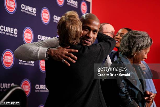 Sportscaster, George Blaha, and his wife, Mary Blaha gift Jaden Ivey of the Detroit Pistons, his mother Niele Ivey, his father, Javin Hunter a...