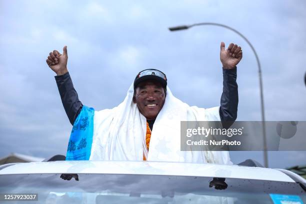 Kami Rita Sherpa, a Nepali record breaking Sherpa guide who has set the record of most ascend of Mount Everest- 28 times waves at media upon arriving...