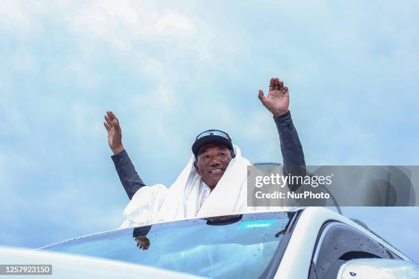 Kami Rita Sherpa, a Nepali record breaking Sherpa guide who has set the record of most ascend of Mount Everest- 28 times waves at media upon arriving...
