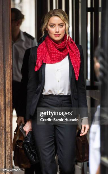 Amber Heard arrives at Royal Courts of Justice, Strand on July 24, 2020 in London, England. Hollywood Actor Johnny Depp is suing News Group...