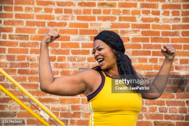 woman strength, determination, healthy lifestyle - muscular build stock pictures, royalty-free photos & images