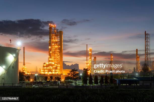 oil​ refinery​ and​ plant and tower column of petrochemistry industry in oil​ and​ gas​ ​industrial with​ cloud​ during sunrise​ in thailand. - distillation column stock pictures, royalty-free photos & images