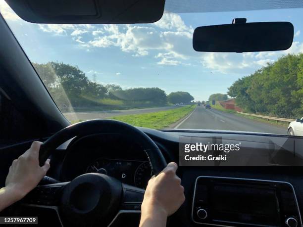 point of view of a woman driver on the highway - front view bildbanksfoton och bilder