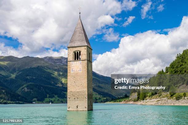 bell tower of curon venosta, lake resia - reschensee, south tyrol, italy - campanile foto e immagini stock