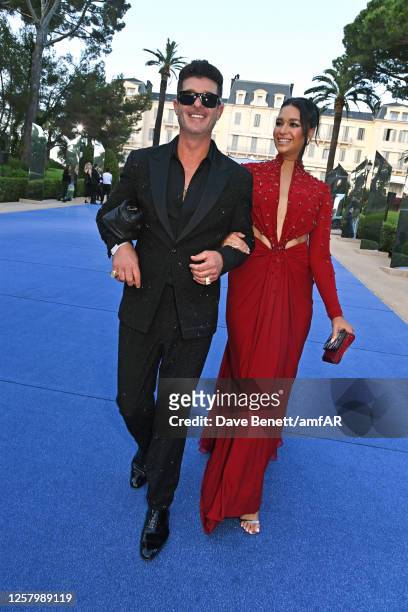 Robin Thicke and April Love Geary attend the amfAR Cannes Gala 2023 at Hotel du Cap-Eden-Roc on May 25, 2023 in Cap d'Antibes, France.