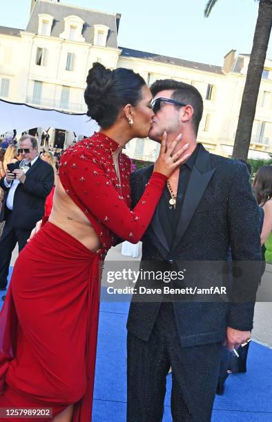 April Love Geary and Robin Thicke attend the amfAR Cannes Gala 2023 at Hotel du Cap-Eden-Roc on May 25, 2023 in Cap d'Antibes, France.