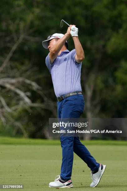 Charlie Wi hits his second shot on the 11th hole during the first round of the KitchenAid Senior PGA Championship at Fields Ranch East on Thursday,...