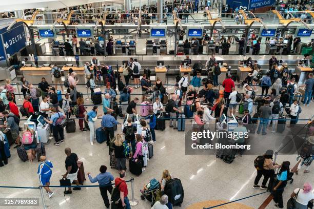 Travelers at Hartsfield-Jackson Atlanta International Airport in Atlanta, Georgia, US, on Thursday, May 25, 2023. Long airport lines, jammed planes,...