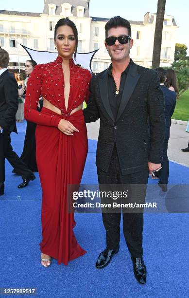 April Love Geary and Robin Thicke attend the amfAR Cannes Gala 2023 at Hotel du Cap-Eden-Roc on May 25, 2023 in Cap d'Antibes, France.