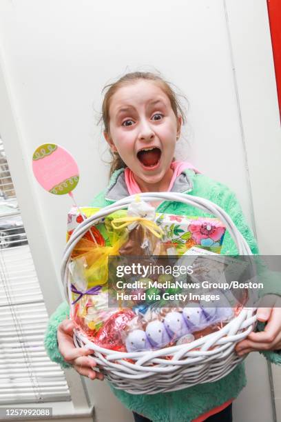 April 19, 2019: Erica Bayliss of Brockton, poses with a picture perfect Easter basket during her visit to Phillips Candy House on Friday, April 19,...