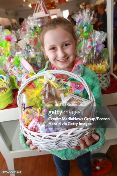 April 19, 2019: Erica Bayliss of Brockton, poses with a picture perfect Easter basket during her visit to Phillips Candy House on Friday, April 19,...