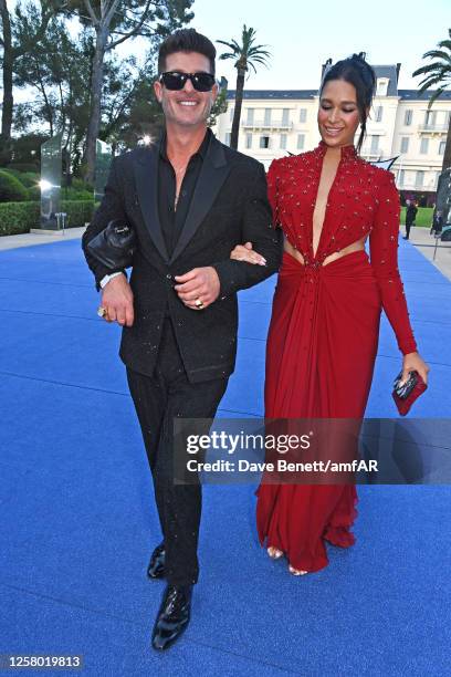 Robin Thicke and April Love Geary attend the amfAR Cannes Gala 2023 at Hotel du Cap-Eden-Roc on May 25, 2023 in Cap d'Antibes, France.