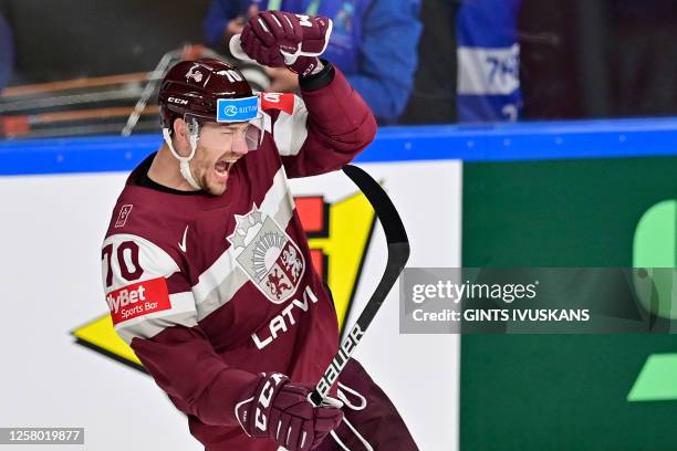 Latvia's forward Miks Indrasis celebrates after a goal during the IIHF Ice Hockey Men's World Championships quarter final match between Sweden and...