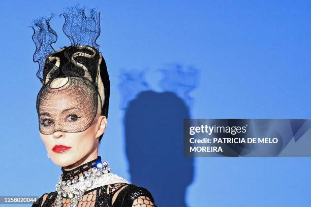 British designer Daphne Guinness arrives to attend the annual amfAR Cinema Against AIDS Cannes Gala at the Hotel du Cap-Eden-Roc in Cap d'Antibes,...