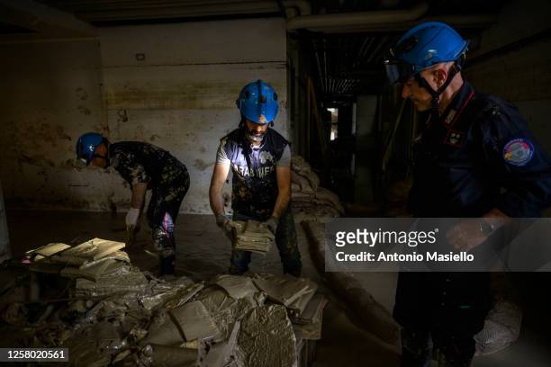 Carabinieri for the protection of cultural heritage recover and clean books and manuscripts dating back to 1500-1600 soiled with mud after heavy...