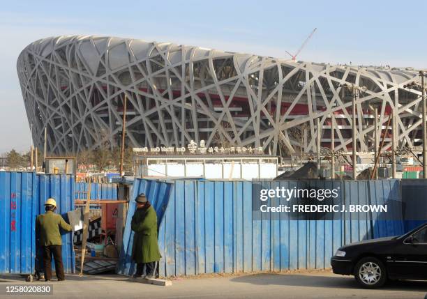 By Charles Whelan Construction continues at the National Stadium , or Birds Nest, during a recent winter morning on January 28, 2008. China's 40...