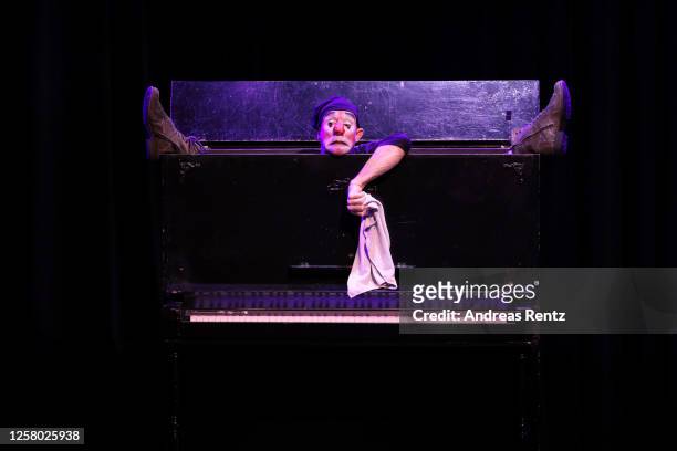 Clown performs at a piano on stage during the theatre play "Beethovens verschollenes Werk" at GOP Varieté Theater on July 24, 2020 in Bonn, Germany.