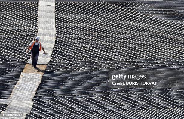 Man is at work on the site of the future International Thermonuclear Experimental Reactor on August 30, 2011 in Saint-Paul-les-Durance. Iter was set...