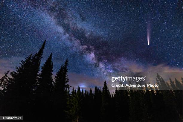 neowise comet in night sky with milky way galaxy - comet stock pictures, royalty-free photos & images