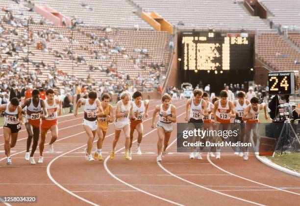 Competitors in the final of the Men's 10000 meter race of the United States Olympic Track and Field Trials jostle for position at the start on June...