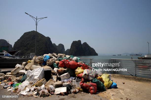 This photo taken on May 17 shows a pile of trash collected from Ha Long Bay in northeast Vietnam. More than seven million visitors came to visit the...