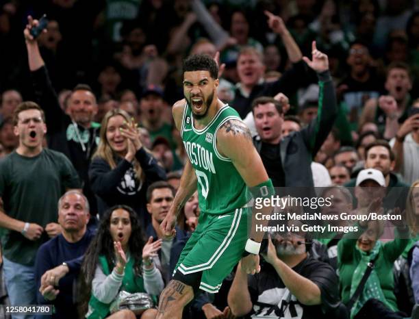 Jayson Tatum of the Boston Celtics celebrates during the first quarter of the NBA Eastern Conference Finals against the Miami Heat at the TD Garden...