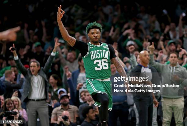 Marcus Smart of the Boston Celtics celebrates during the first quarter of the NBA Eastern Conference Finals against the Miami Heat at the TD Garden...