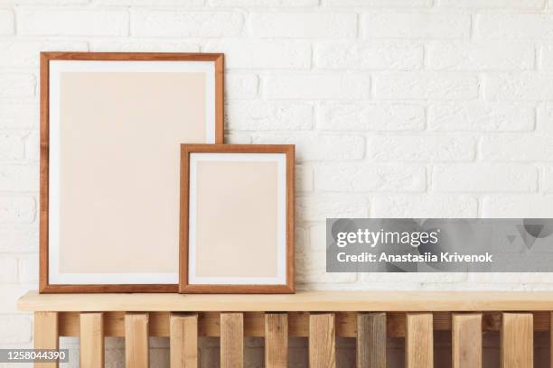 set of 2 wooden different frame mockup with mat on white wall. poster mockup. clean, modern, minimal frame. indoor interior, show text or product - clean house stockfoto's en -beelden