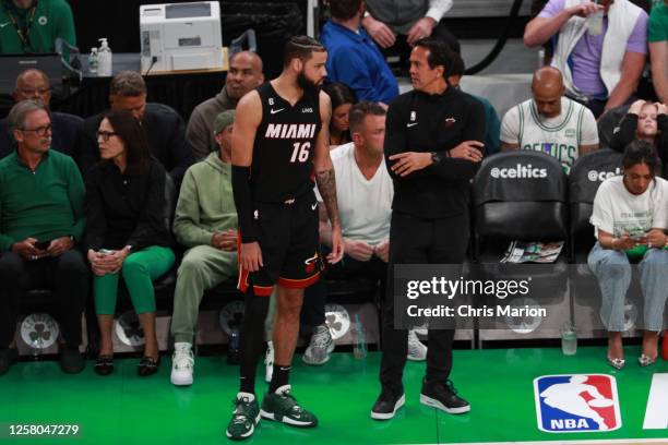 Head Coach Erik Spoelstra of the Miami Heat and Caleb Martin talk during the game against the Boston Celtics during the Eastern Conference Finals of...
