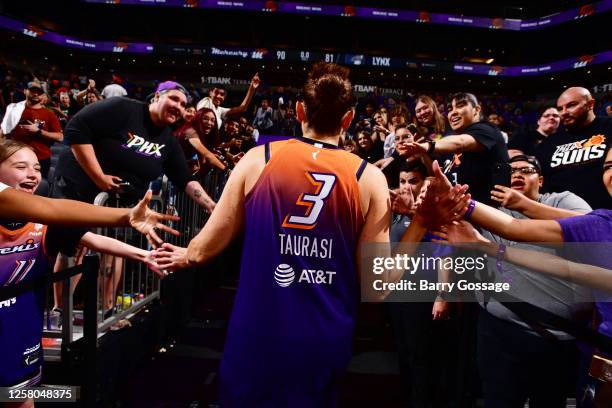 Diana Taurasi of the Phoenix Mercury high fives fans after the game against the Minnesota Lynx on May 25, 2023 at Footprint Center in Phoenix,...