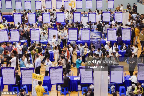 People attend a job fair in Huaian, in China's eastern Jiangsu province on May 26, 2023. / China OUT