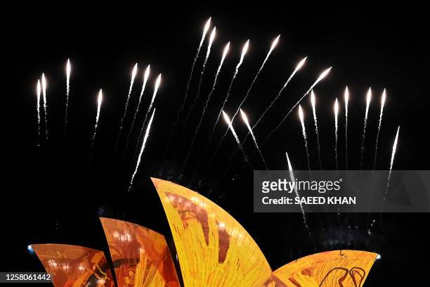 Fireworks explode as the sails of the Opera House are illuminated with lights at the start of the Vivid Sydney festival in Sydney on May 26, 2023.
