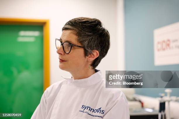 Chloe Smith, acting UK science, innovation and technology secretary, talks with researchers inside a laboratory, using equipment manufactured by...