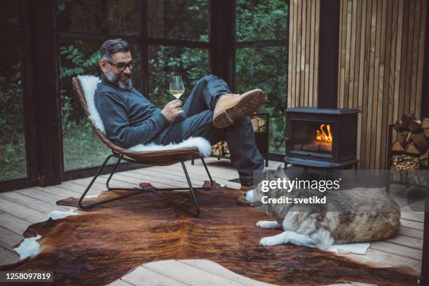 weekendje weg - middle age man with dog stockfoto's en -beelden