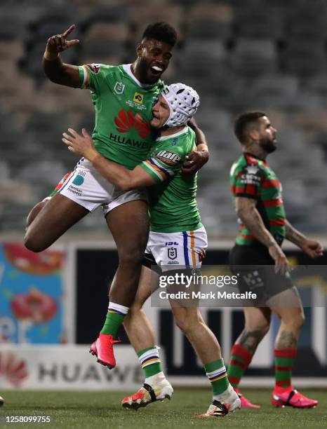 Jarrod Croker of the Raiders celebrates his try with Semi Valemei of the Raiders during the round 11 NRL match between the Canberra Raiders and the...