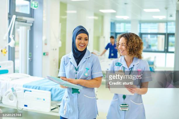 happy nurse team - muslim student stock pictures, royalty-free photos & images