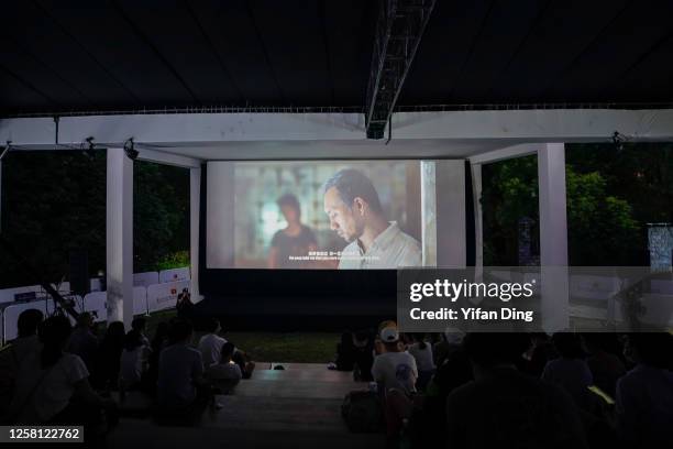 Audiences watch film Long Day's Journey Into Night during an outdoor screening event on July 25, 2020 in Shanghai, China. The 23rd edition of...