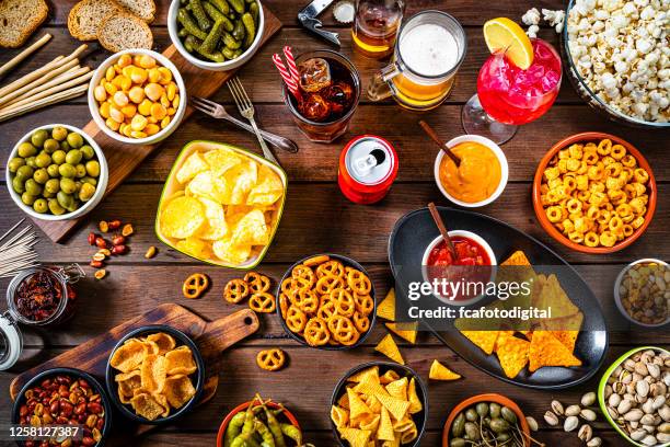 party table with salty snacks and drinks - no trans fat stock pictures, royalty-free photos & images
