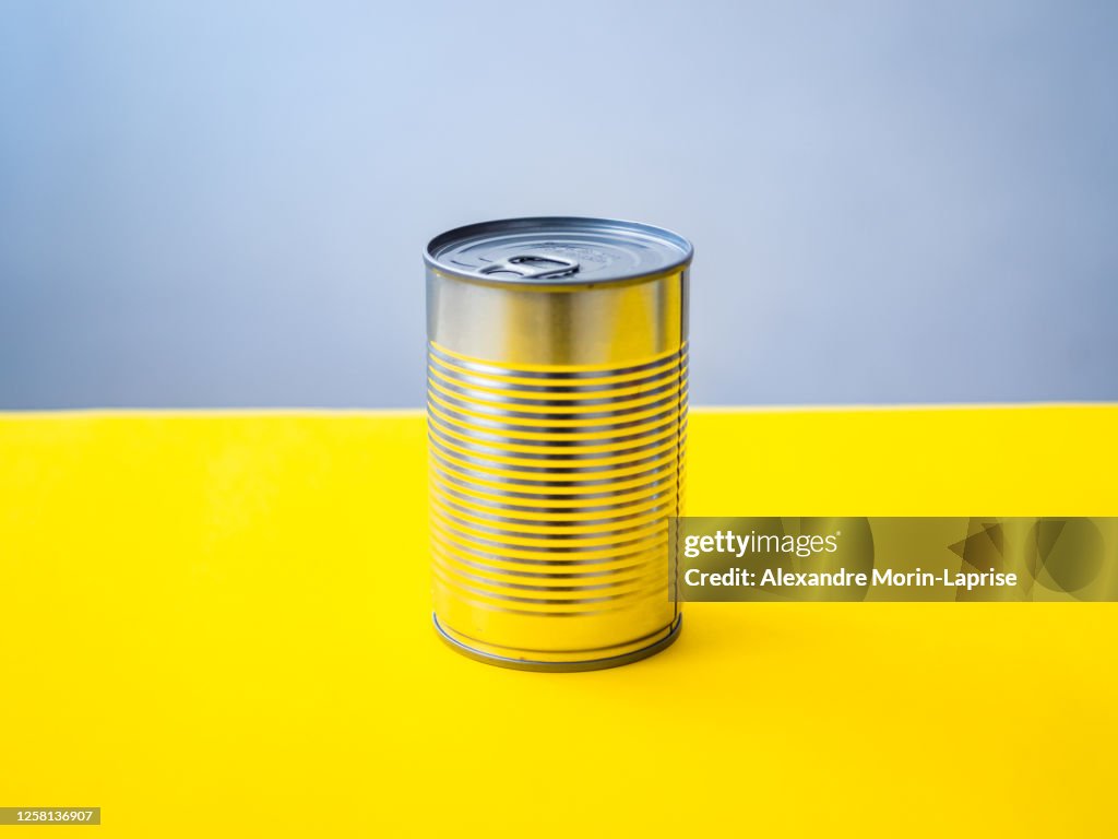 Silver Can on a Yellow Background